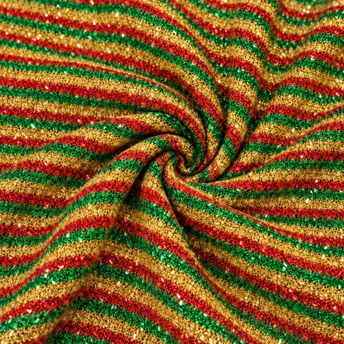Tela esponjillón tricolor en espiral, con detalle de su acabado