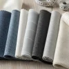 Variedad de 7 clases de telas de algodón esenciales, mostrando diferentes texturas, ideales para moda y hogar.