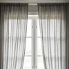 Cortinas sencillas y elegantes hechas en casa, colgadas de un tubo o barra, ilustrando cómo hacer cortinas para tubo.